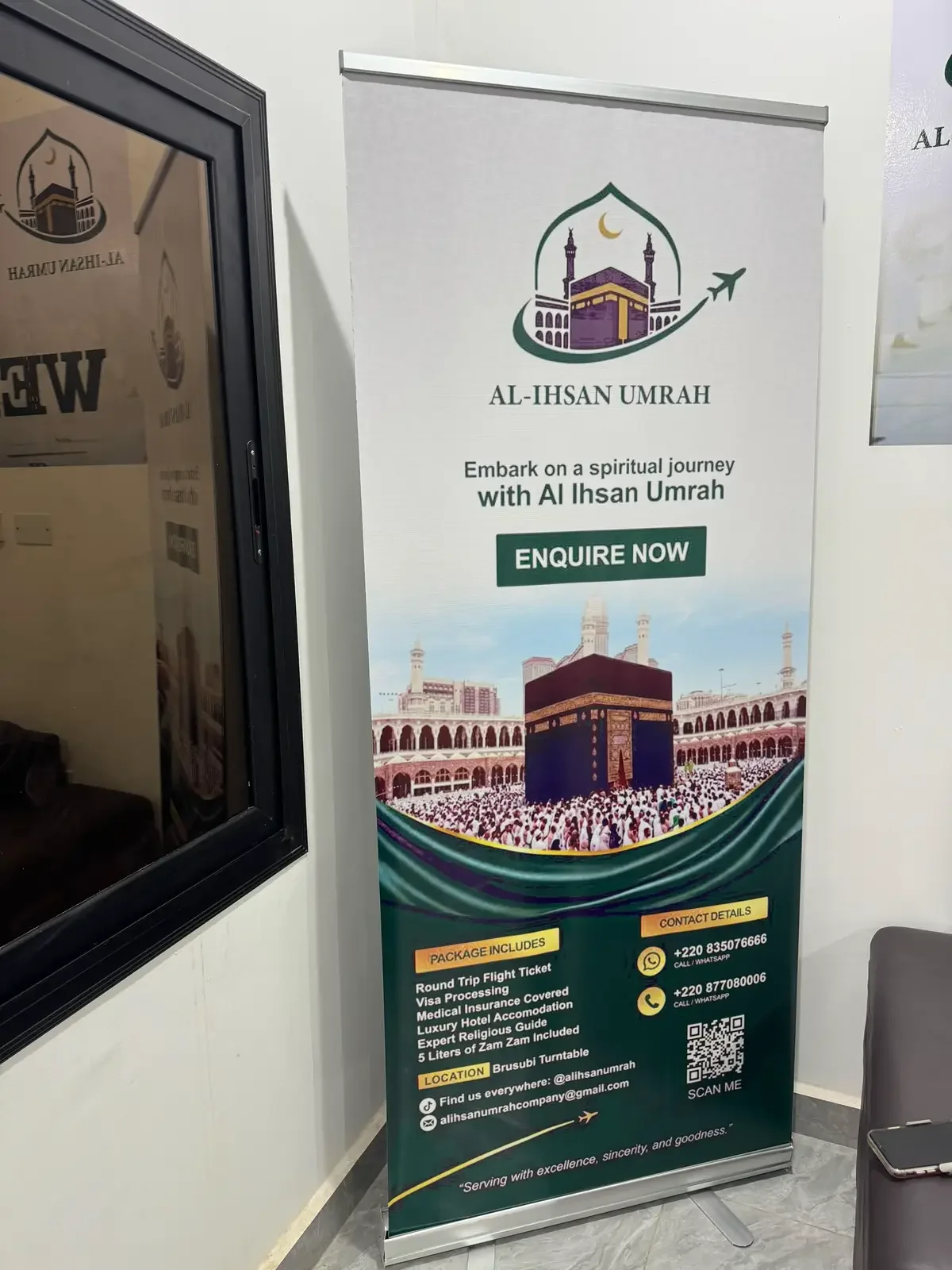 Al-Ihsan Umrah welcome banner inside the office