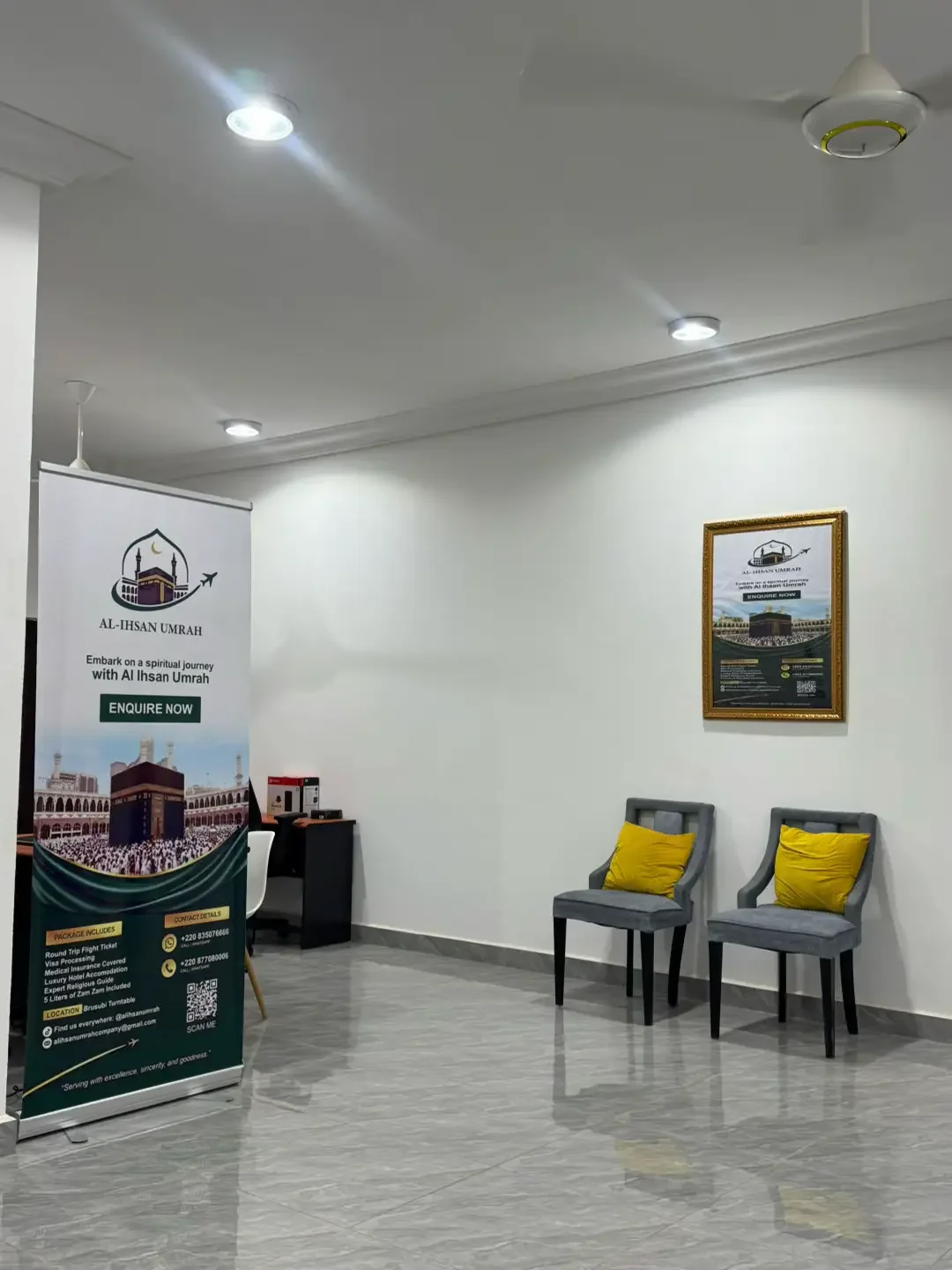 Al-Ihsan Umrah office seating area and branded banner
