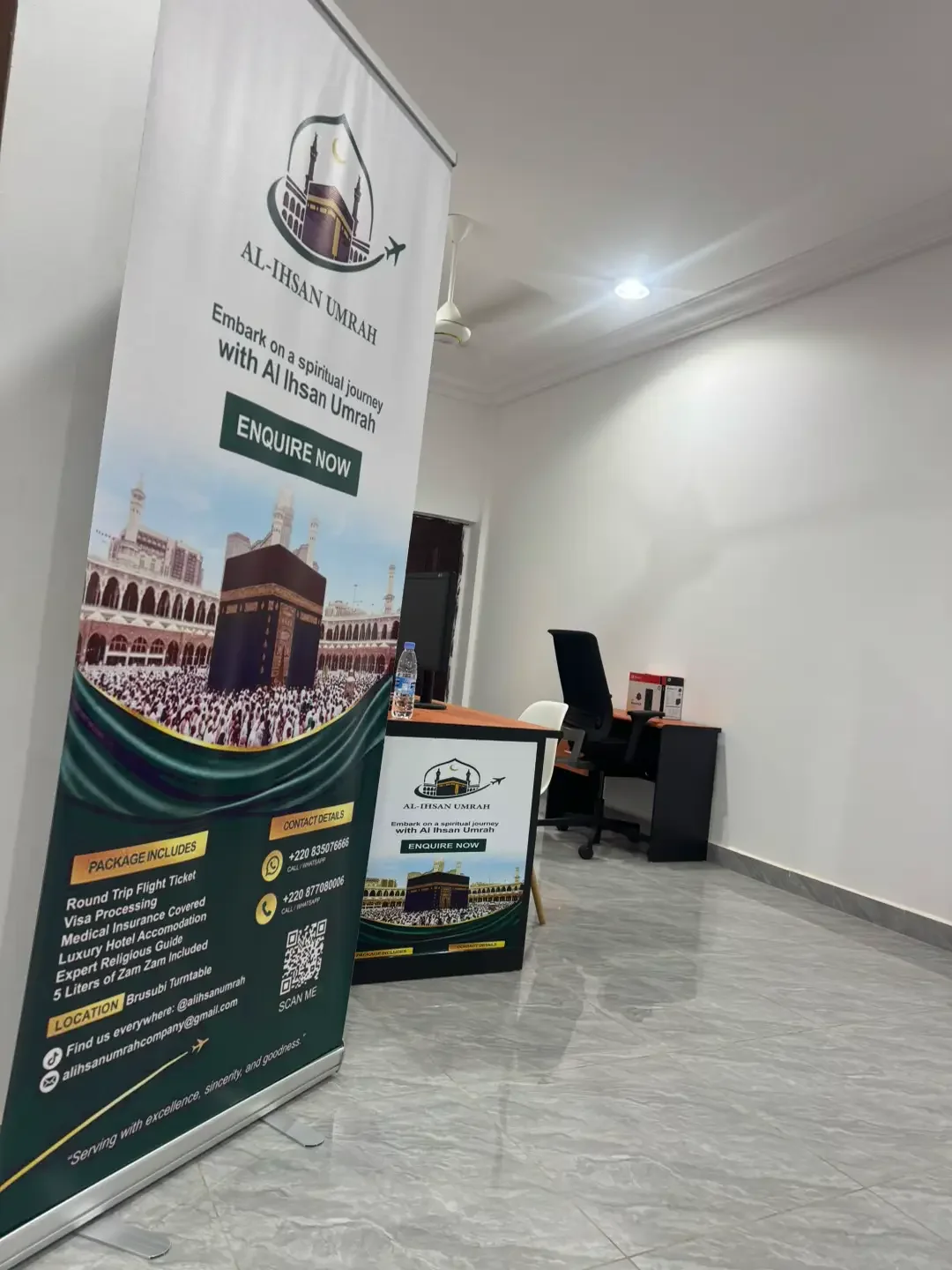 Al-Ihsan Umrah reception desk and branded banner